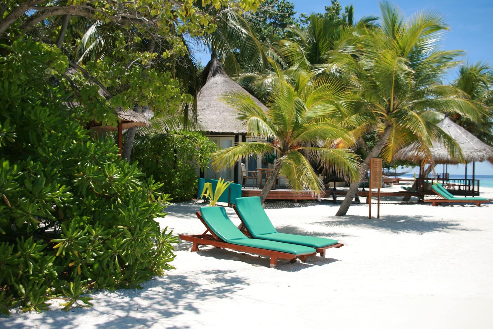 Overwater bungalows on turquoise water in the Maldives